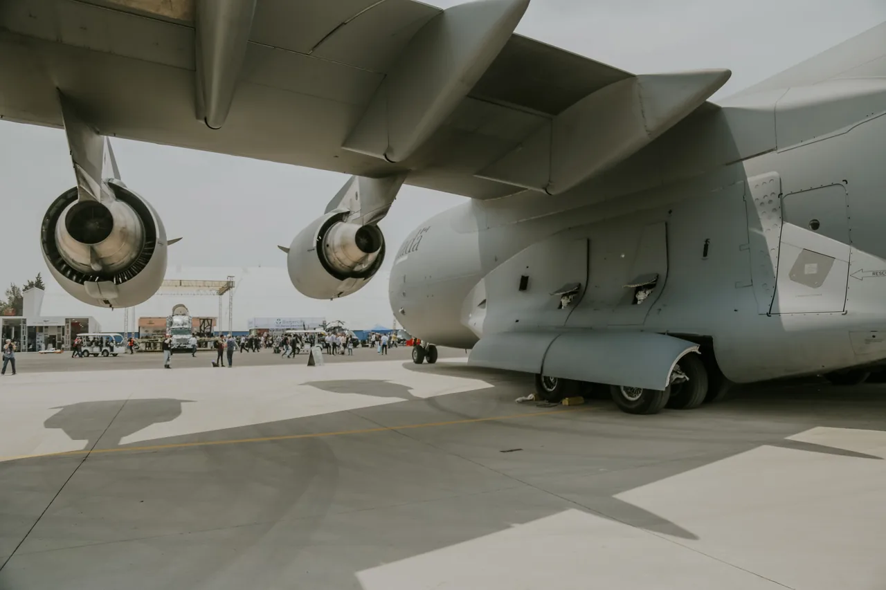 Close-up of C-17 Globemaster on display at outdoor airforce event showcasing aviation technology