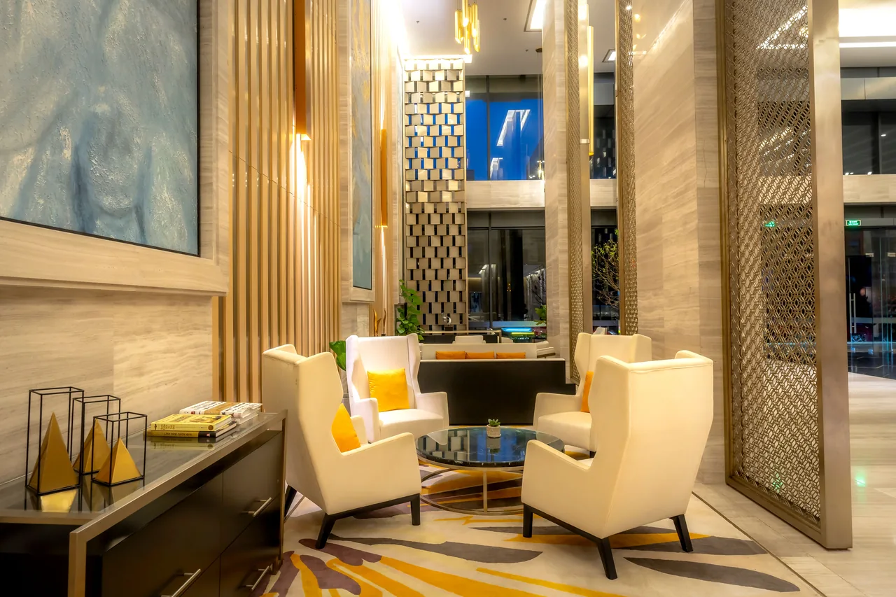 Luxurious hotel lobby featuring comfortable armchairs and sophisticated decor